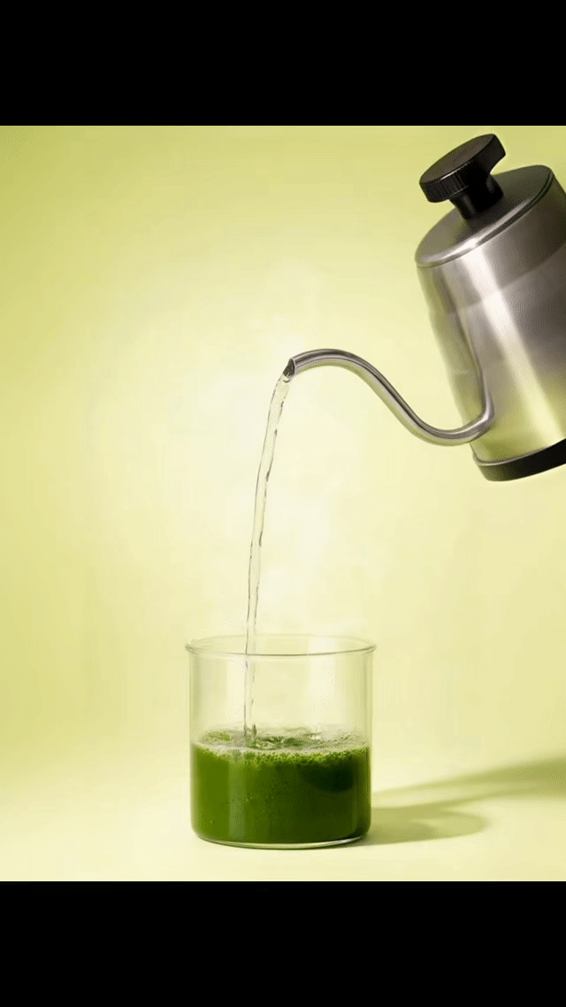 stirring matcha paste with hot water