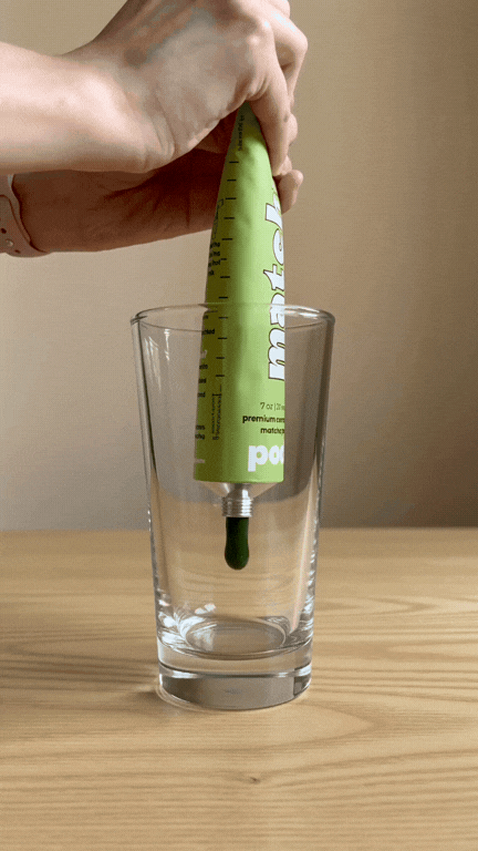 squeeze matcha paste into a glass