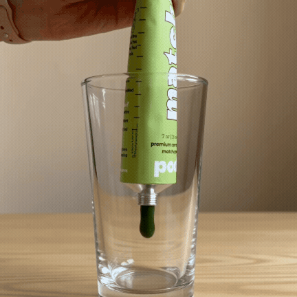 squeeze matcha paste into a glass
