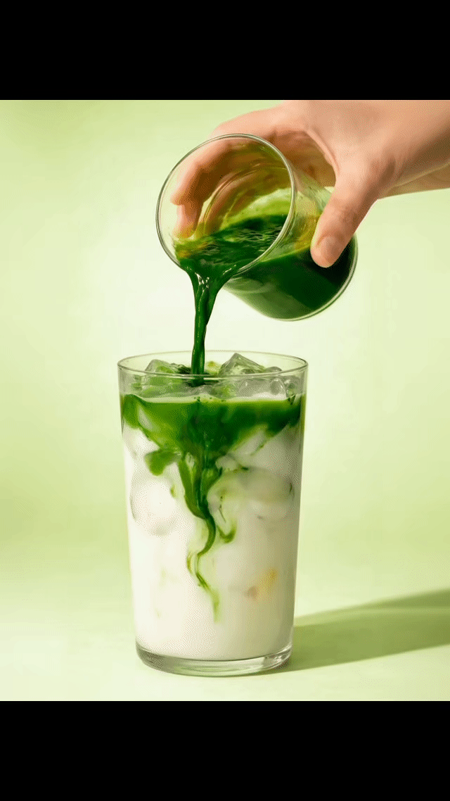 pouring matcha over milk
